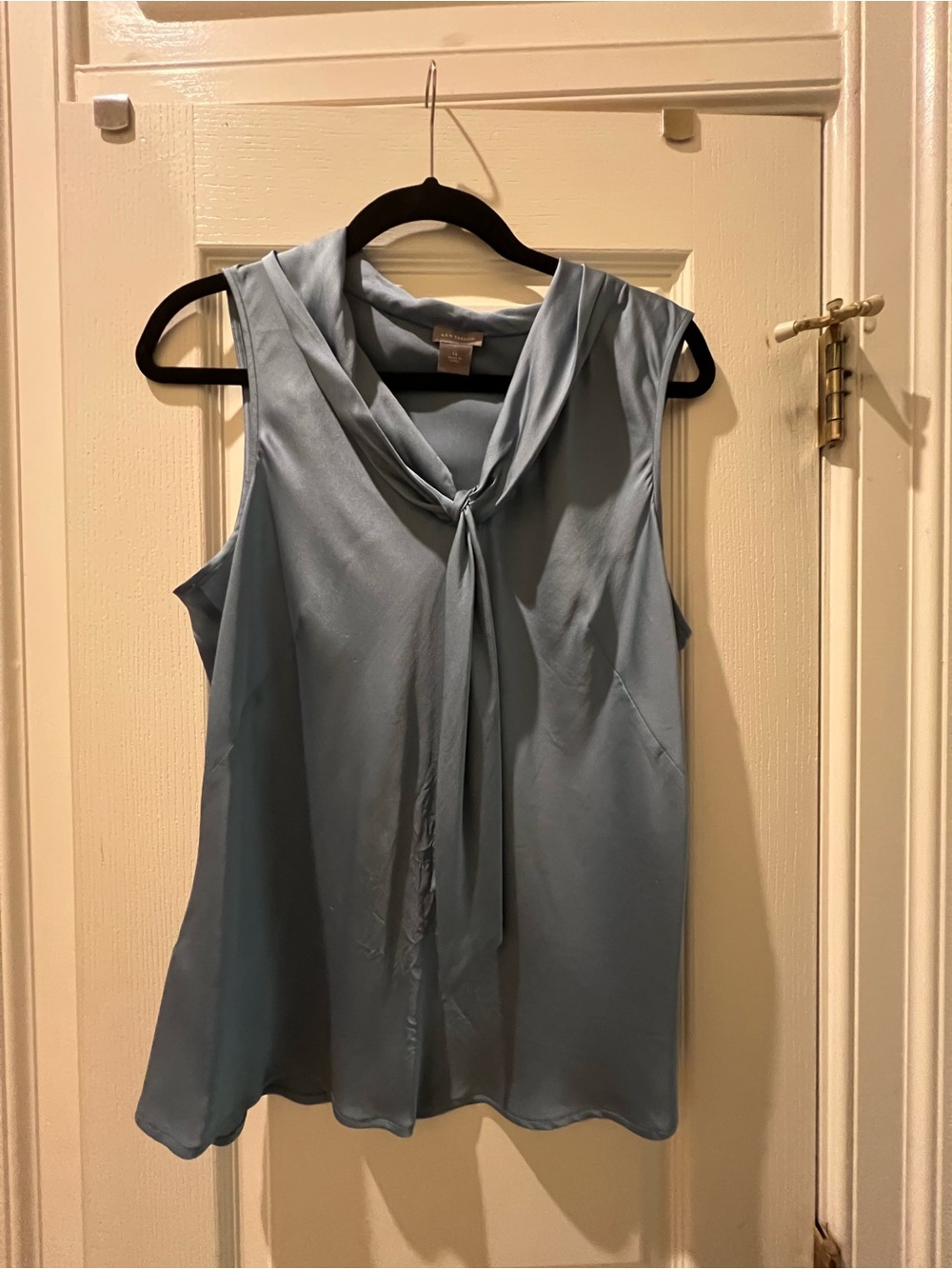 Blue silk Ann Taylor sleeveless blouse with draped neckline and bow, size 14